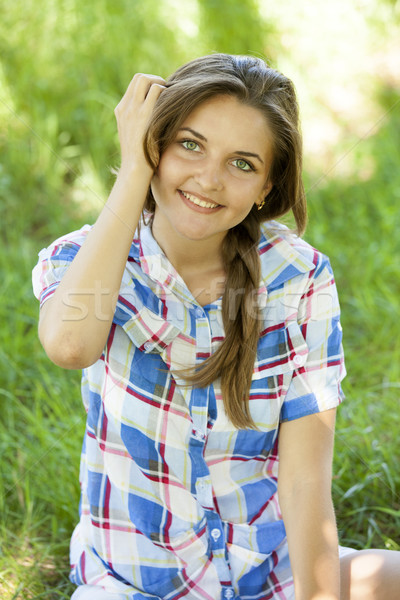 Güzel genç kız park yeşil ot kız bahar Stok fotoğraf © Massonforstock