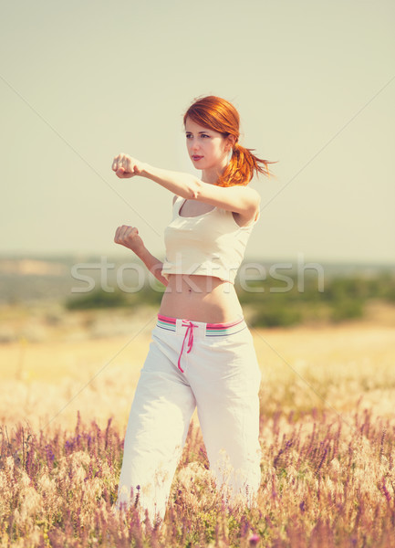 woman doing morning sports exercises Stock photo © Massonforstock