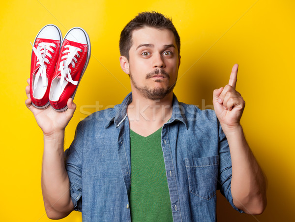guy in shirt with red gumshoes Stock photo © Massonforstock