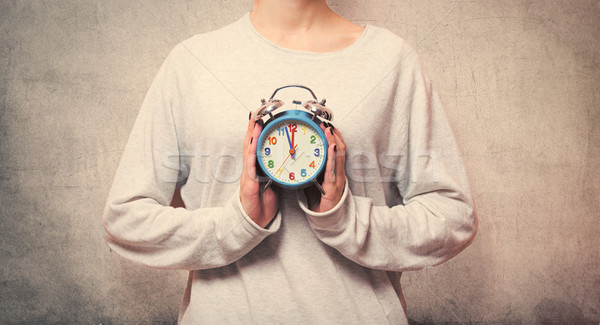 Mooie jonge vrouw handen cute wekker Stockfoto © Massonforstock