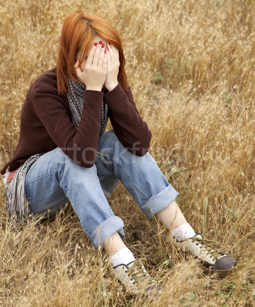 одиноко печально девушки области трава джинсов Сток-фото © Massonforstock