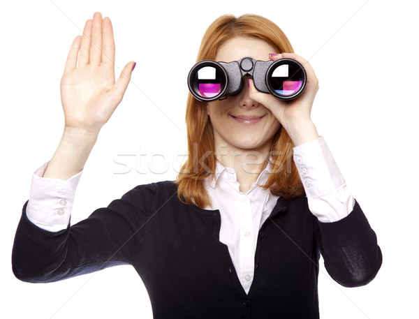 Business women seeking with binocular and show right hand. Studio shot. Stock photo © Massonforstock