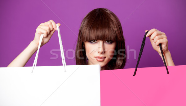 photo of beautiful young woman with colorful shopping bags on th Stock photo © Massonforstock