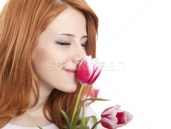 Lány tulipánok tavasz mosoly arc boldog Stock fotó © Massonforstock