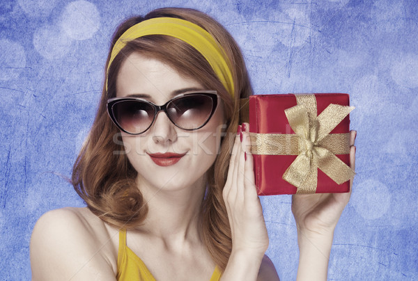 American redhead girl in sunglasses with gift.  Stock photo © Massonforstock