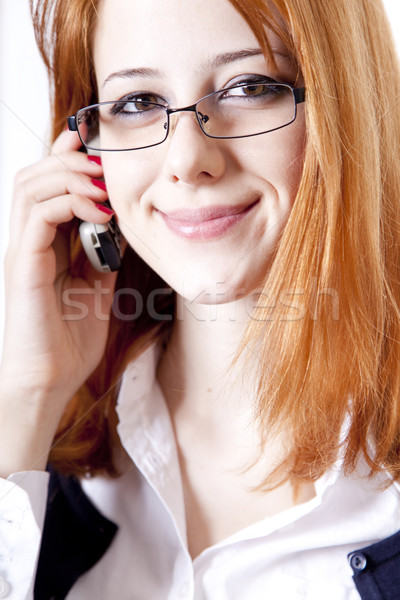 Stock photo: Business women calling by phone. Studio shot.