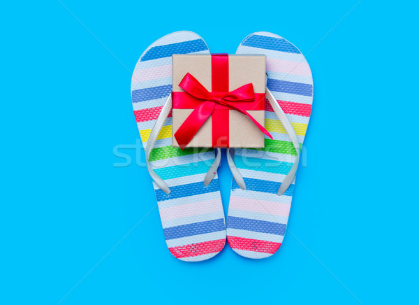 colorful sandals and cute small gift on the wonderful blue backg Stock photo © Massonforstock