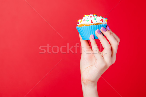 Foto weiblichen Hand halten Cupcake wunderbar Stock foto © Massonforstock