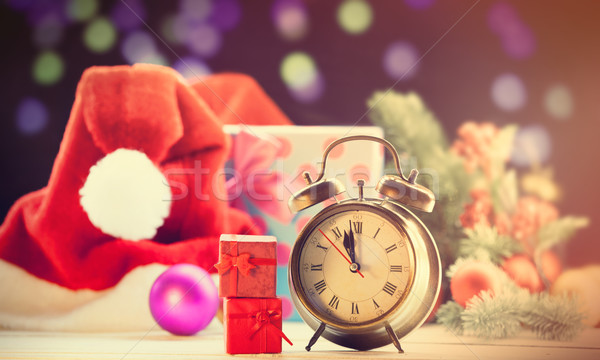 Stock photo: Alarm clock and two red gifts 
