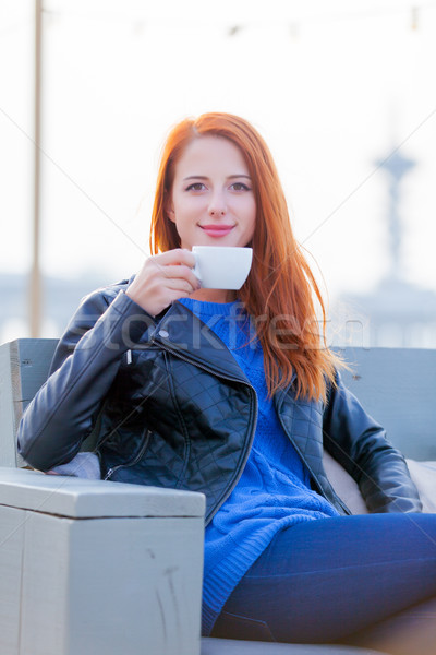 beautiful young woman with cup of coffee sitting in the cafe on  Stock photo © Massonforstock