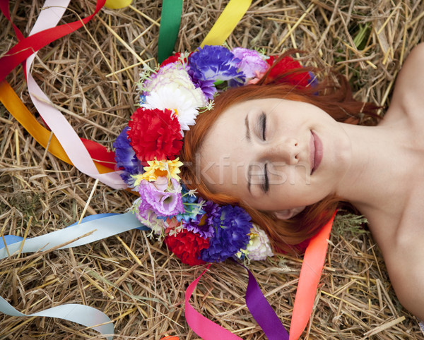 Slav girl with wreath lying at field Stock photo © Massonforstock