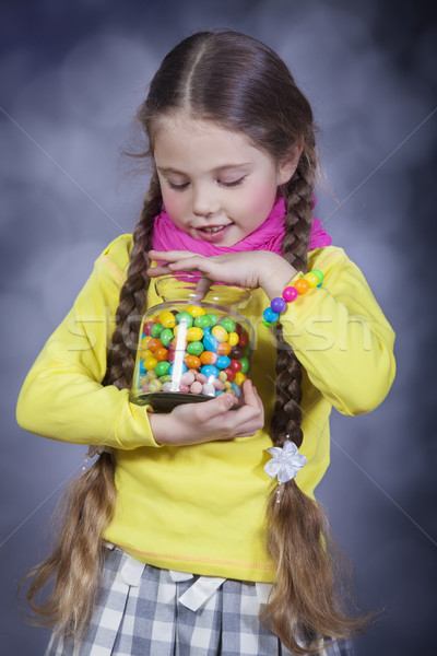 Little girl with jelly bean. Stock photo © Massonforstock