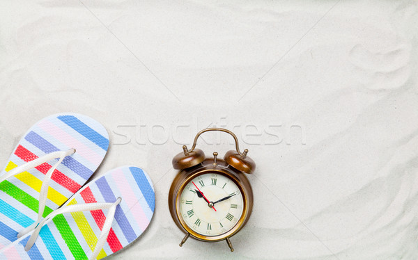Colorful flip flops and classic alarm clock  Stock photo © Massonforstock