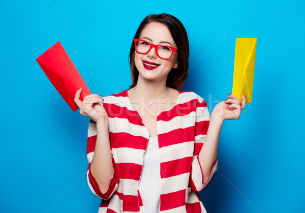 smiling woman with two envelopes Stock photo © Massonforstock