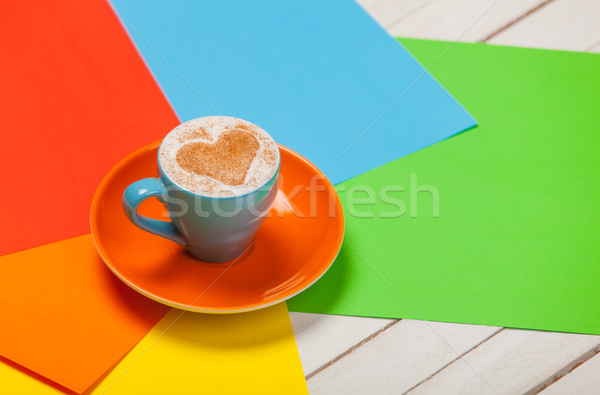 photo of beautiful blue cup of coffee and colorful sheets of pap Stock photo © Massonforstock