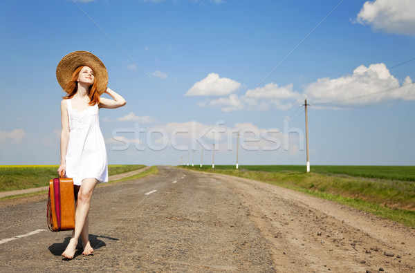 Magányos lány bőrönd vidéki út nők természet Stock fotó © Massonforstock