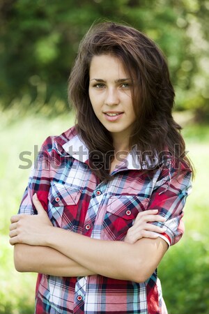 Beautiful teen girl in the park at green grass. Stock photo © Massonforstock