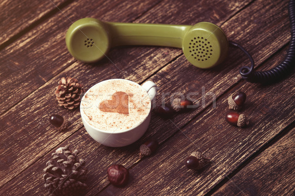 Cup of coffee with heart shape and green handset  Stock photo © Massonforstock