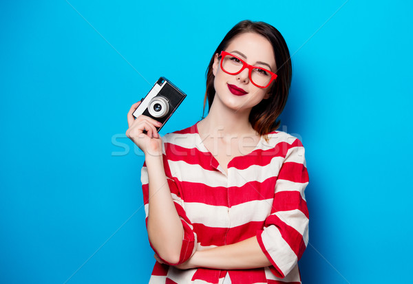 young smiling woman with retro camera Stock photo © Massonforstock