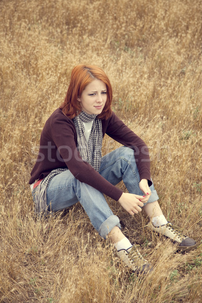 Lonely sad red-haired girl at field Stock photo © Massonforstock