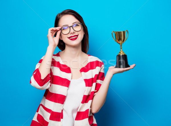 young smiling woman with cup trophy Stock photo © Massonforstock