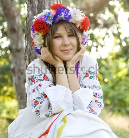 Slav girl with wreath at park. Stock photo © Massonforstock