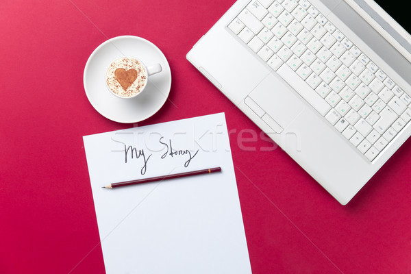 paper, coffee and laptop lying on the table Stock photo © Massonforstock