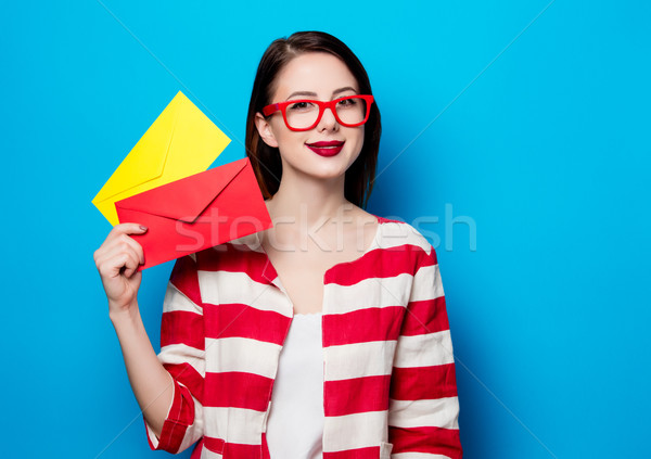 smiling woman with two envelopes Stock photo © Massonforstock