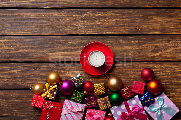 Stock photo: Cup of coffee and Christmas gifts 