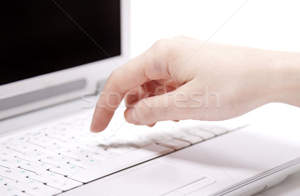 Human hands over laptop keypad during typing. Studio shot. Stock photo © Massonforstock