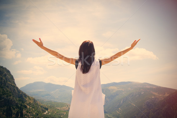 beautiful young woman standing in front of splendid mountain bac Stock photo © Massonforstock