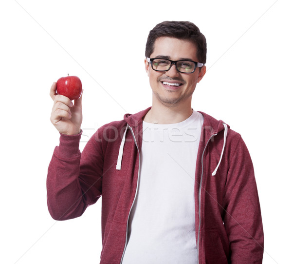 Young man in white shirt and with red apple Stock photo © Massonforstock