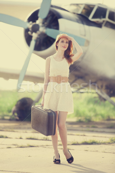 Magányos lány bőrönd repülőgép fotó öreg Stock fotó © Massonforstock