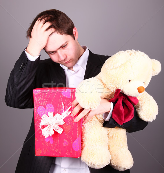 Boy with present box and teddy bear can't select a present in St Stock photo © Massonforstock