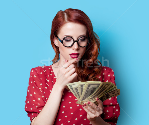 girl in red dress with money Stock photo © Massonforstock