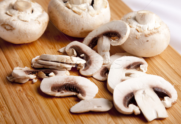 Field mushrooms cut by segments Stock photo © Massonforstock