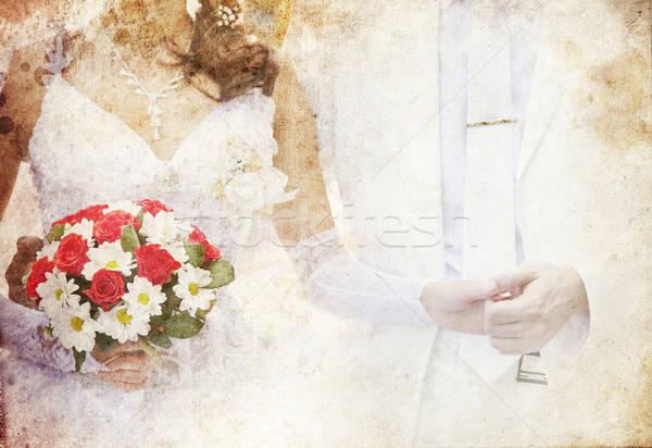 Bridegroom and bride holding beautiful red roses wedding flowers Stock photo © Massonforstock