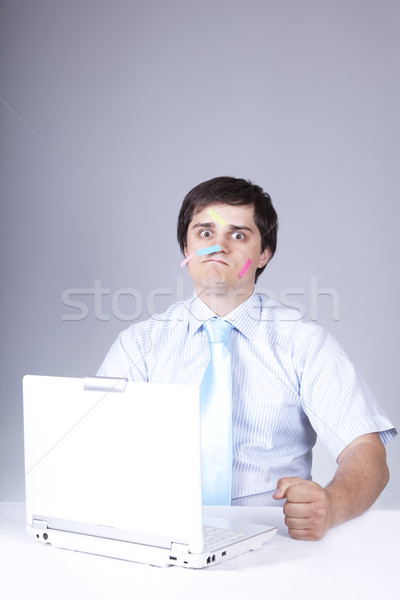Young boss with white laptop.  Stock photo © Massonforstock