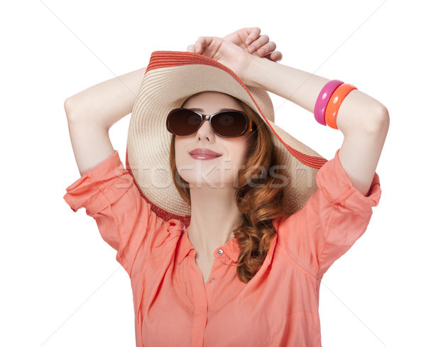 Beautiful red-haired girl in hat at white background Stock photo © Massonforstock