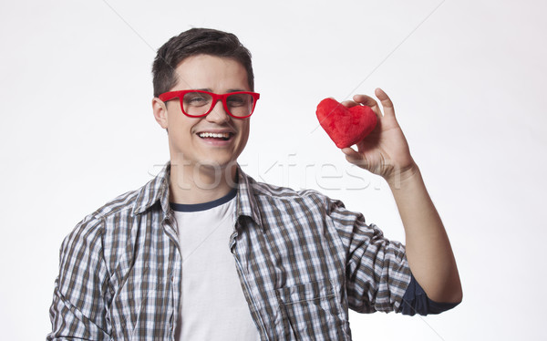 Portrait of a young man with heart shape Stock photo © Massonforstock