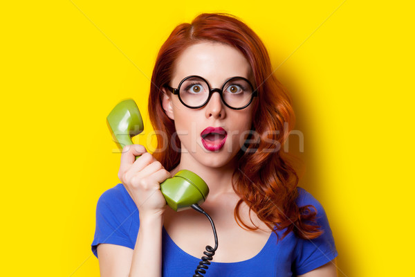 beautiful surprised young woman with retro phone on the wonderfu Stock photo © Massonforstock