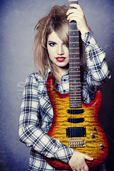 Stock photo: Style girl with guitar.