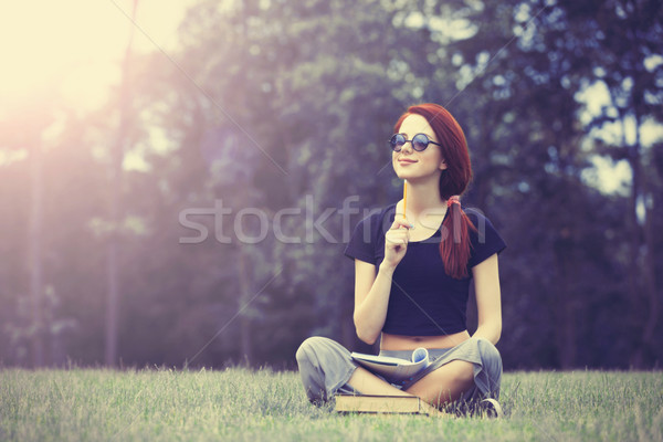 Joven indie estilo ropa cuaderno hierba verde Foto stock © Massonforstock