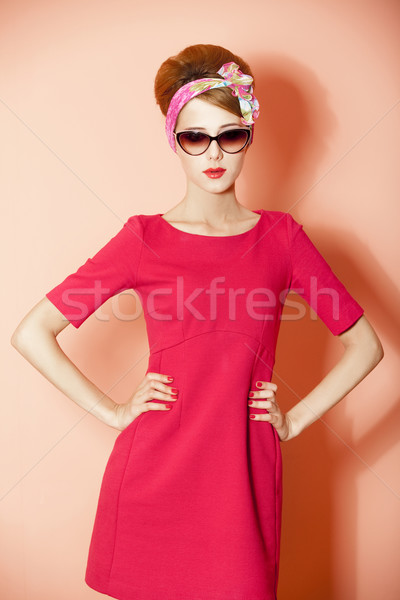 Style redhead girl at pink background. Stock photo © Massonforstock