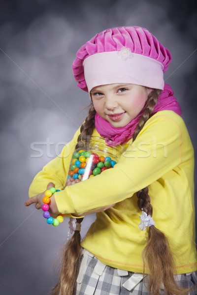 Little girl with jelly bean. Stock photo © Massonforstock