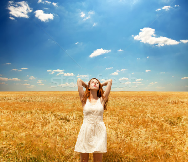 Stock photo: Redhead girl at wheat field