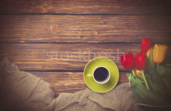 Cup of coffee with tulips near fabric Stock photo © Massonforstock