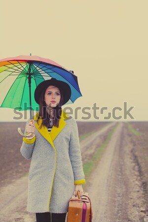 Single girl with umbrella at the street. Stock photo © Massonforstock