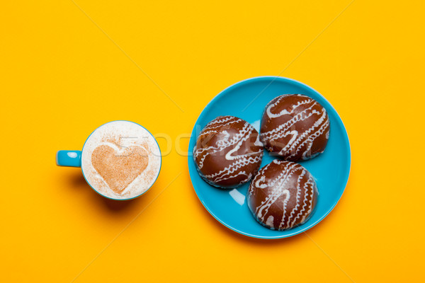 photo of cup of coffee and cookies on the wonderful orange backg Stock photo © Massonforstock