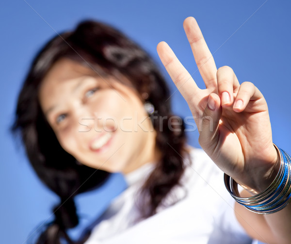 Portrait of beautiful brunette girl with blue eyes which show ha Stock photo © Massonforstock